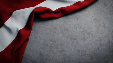 Flag of Latvia on concrete backdrop. Latvian flag background with copy spaceの写真素材
