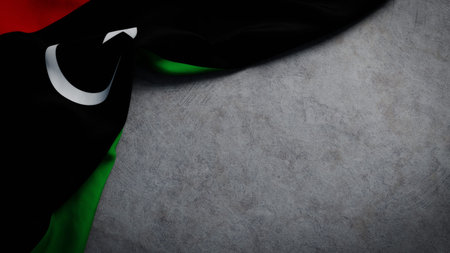 Flag of Libya on concrete backdrop. Libyan flag background with copy spaceの写真素材