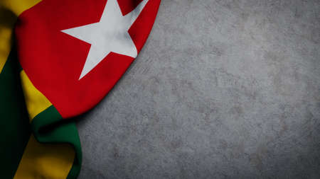 Flag of Togo on concrete backdrop. Togo flag background with copy spaceの写真素材