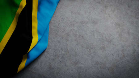 Flag of Tanzania on concrete backdrop. Tanzanian flag background with copy spaceの写真素材