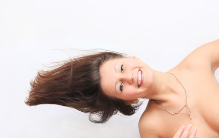 Happy young woman with long hair , she smilesの写真素材