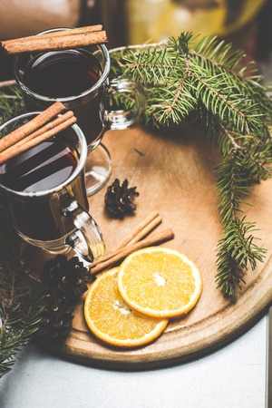 Hot tea with cinnamon and branches of spruceの写真素材
