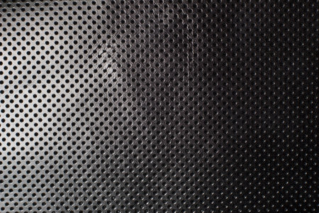 Black and white gradient perforated leather texture backgroundの写真素材