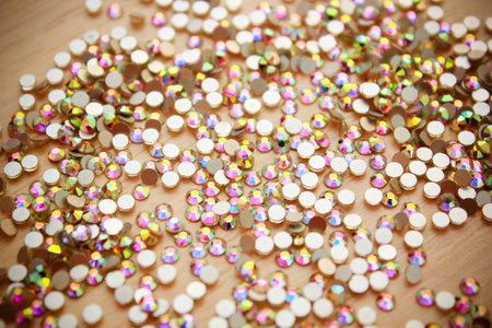 Rhinestone background. Mix of Shiny rhinestones crystals texture as backdrop isolated white studio...