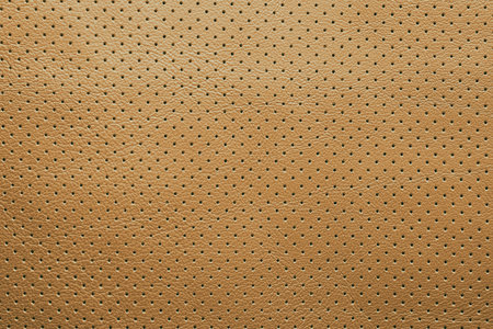 Yellow perforated leather texture background abstract dotsの写真素材