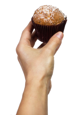 man holding a chocolate muffin on white backgroundの写真素材
