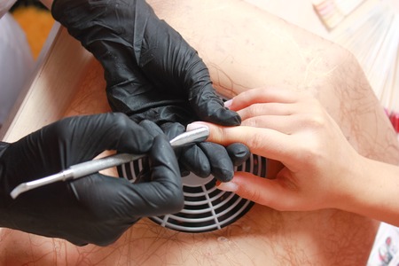 Nail Care At Beauty Salon. Woman Receiving Professional Manicure From Nail Specialist.の写真素材