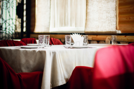 Empty glasses set in restaurantの写真素材