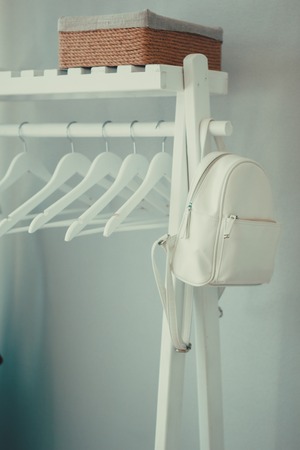 White hanger with white leather backpackの写真素材
