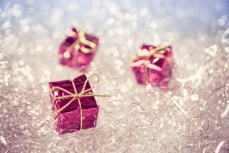 Christmas presents on a shiny background with soft focus.の写真素材
