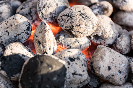 Burning coals in a barbecue grill - selected focus, narrow depth of fieldの写真素材