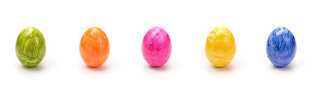 Colorful Easter Eggs in a Row with white Background - Isolatedの写真素材