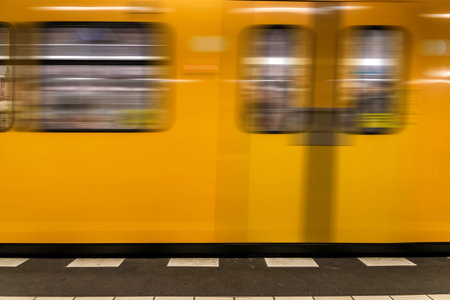 Berlin metro underground - Yellow Train moving - nobodyの写真素材