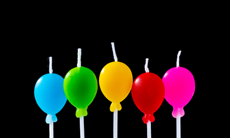 Birthday Balloon Candles isolated on black backgroundの写真素材