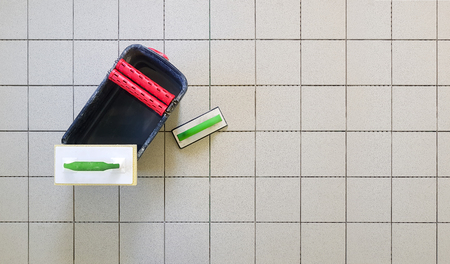 Top view of tools for grouting ceramic tiles. Tilers using a rubber trowel and spongeの写真素材