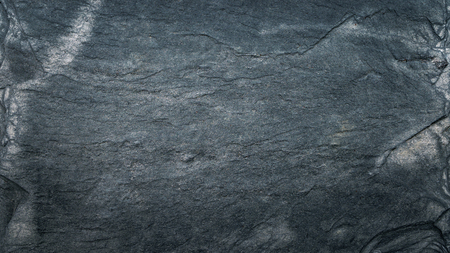 Dark grey black slate texture, floortile, wallpaper or background. Rough texture with fine details.の写真素材