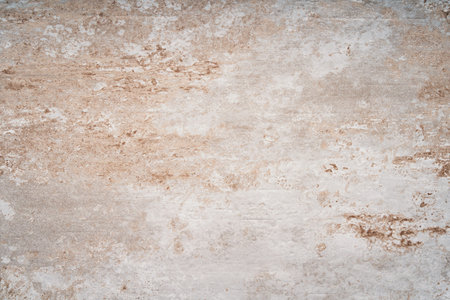 Beige grunge concrete wall background or texture