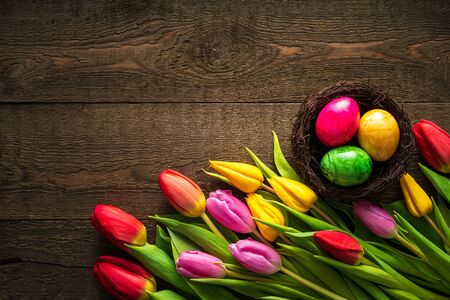 Creative arrangement of tulips on rustic wooden background for March 8, International Womens Day, Birthday , Valentines Day or Mothers day - Closeup - Flat lay.の写真素材