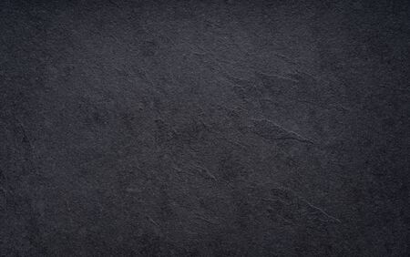 Black wall slate texture rough background, dark concrete floor or old grunge backgroundの写真素材