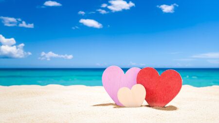 Three hearts on the summer beach - Family Vacation conceptの写真素材
