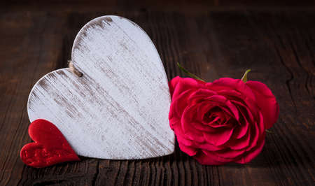 Red roses and wooden heart for Valentine's Day February 14 and Mother's day with copy spaceの写真素材