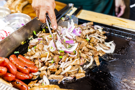 Kenting, Taiwan - JULY 15, 2015: Vendor prepares food at the Kenting main street night market located in Pingtung County.のeditorial素材