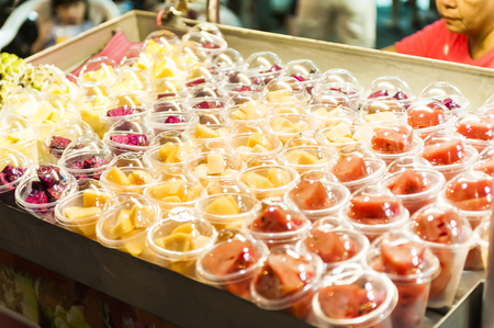 Kenting, Taiwan - JULY 15, 2015: Vendor prepares food at the Kenting main street night market located in Pingtung County.のeditorial素材