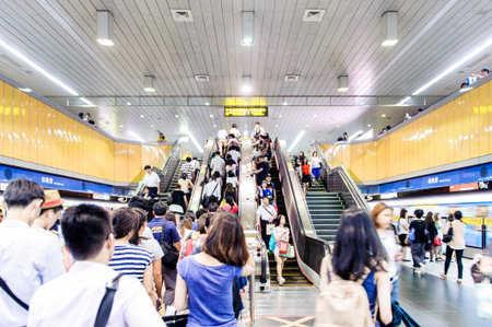 TAIPEI,TAIWAN - JANUARY 19: Passengers waiting and ride the MRT, on January 19,2014 in Taipei. The (Metropolitan Rapid Transit) MRT serves 240,000 people daily with 109 stations and 121 km of track.のeditorial素材