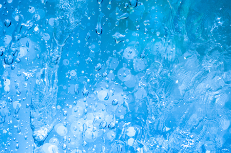 Drops water on the clear glass backgroundの写真素材
