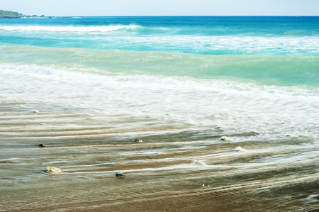 Soft wave of the sea on the sandy beachの写真素材