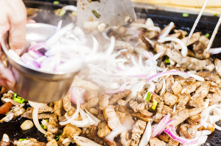  Vendor prepares food at the Kenting main street night market located in Pingtung County.の写真素材