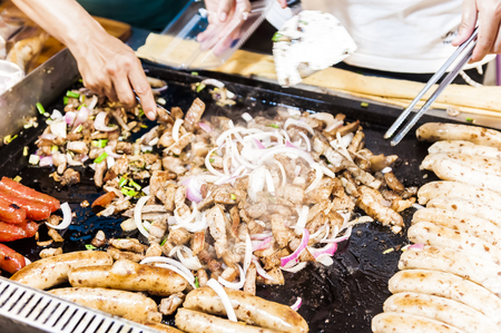 Vendor prepares food at the Kenting main street night market located in Pingtung County.の写真素材
