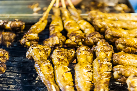 Kenting, Taiwan - JULY 15, 2015: Vendor prepares food at the Kenting main street night market located in Pingtung County.の写真素材