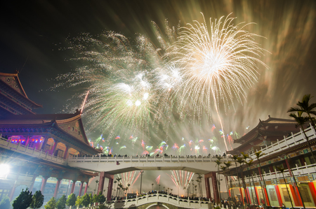 holiday firework over a templeの写真素材