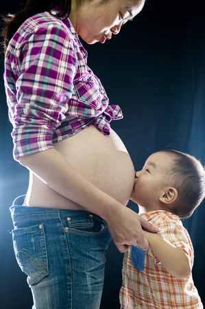 young mother teaches future babyの写真素材
