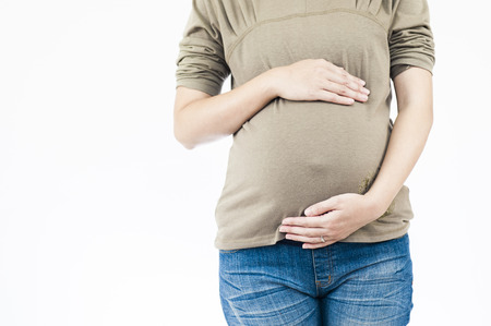 Image of pregnant woman touching her belly with handsの写真素材