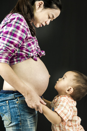 young mother teaches future babyの写真素材