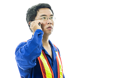 Portrait of a smiling worker. Isolated on whiteの写真素材