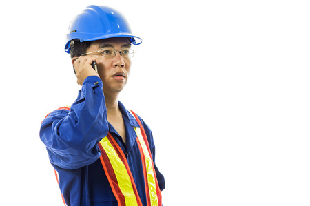 Portrait of a smiling worker. Isolated on whiteの写真素材