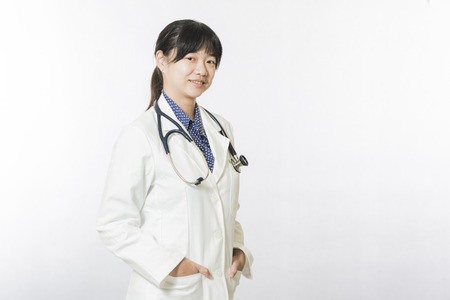 young doctor woman with stethoscope isolated on white backgroundの写真素材
