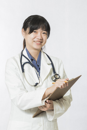 young doctor woman with stethoscope isolated on white backgroundの写真素材