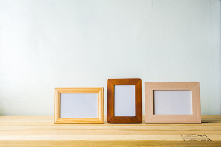 Indoor plant on wooden table and white wallの写真素材