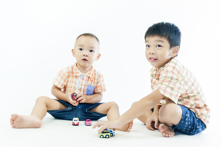 two children boys play togetherの写真素材