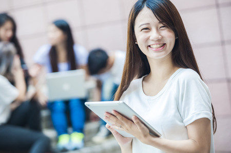 group of happy college students outdoorsの写真素材