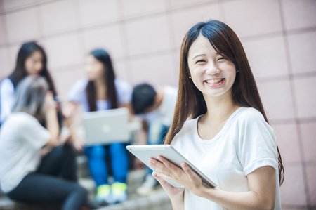 group of happy college students outdoorsの写真素材