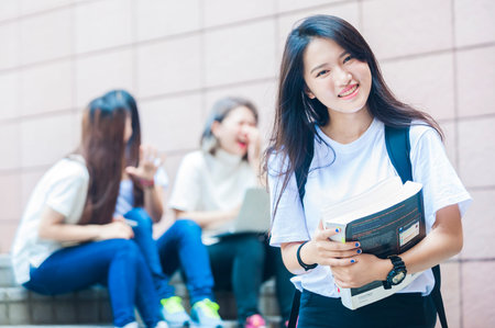 group of happy college students outdoorsの写真素材