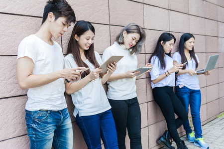 group of happy college students outdoorsの写真素材