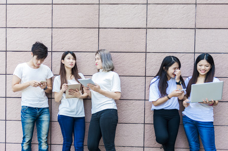 group of happy college students outdoorsの写真素材