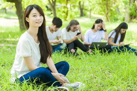 group of happy college students outdoorsの写真素材