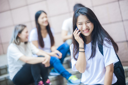 group of happy college students outdoorsの写真素材